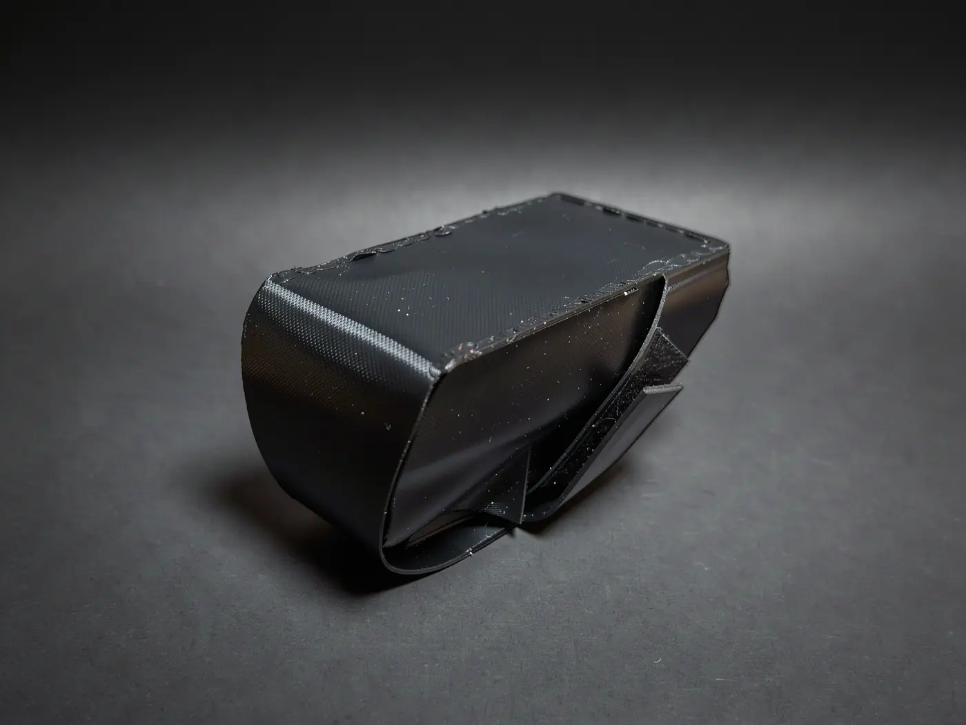 The closed black TPU saddle bag in the studio, without contents